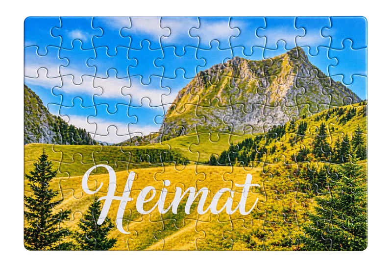 Fotopuzzle mit Schweizer Berglandschaft und Schriftzug Heimat
